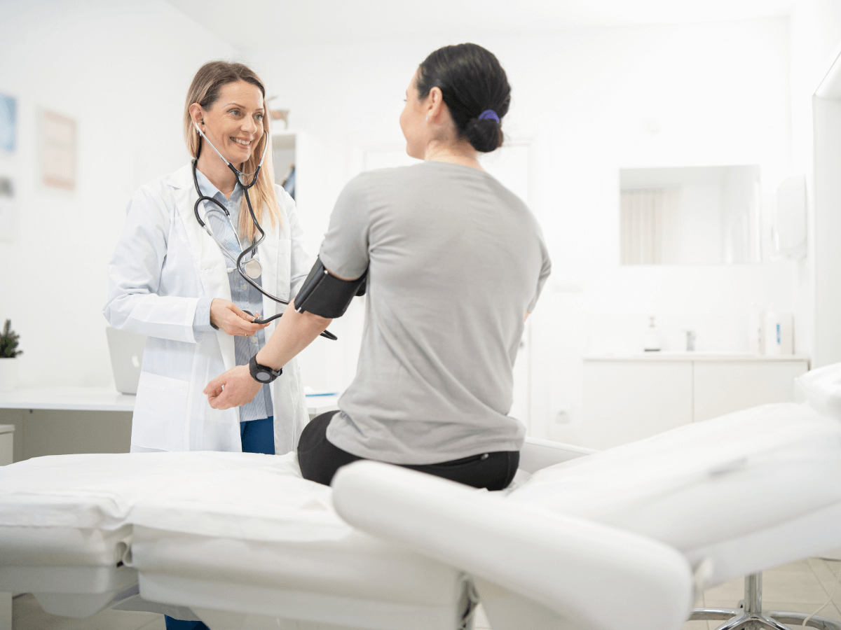 woman sitting with a doctor